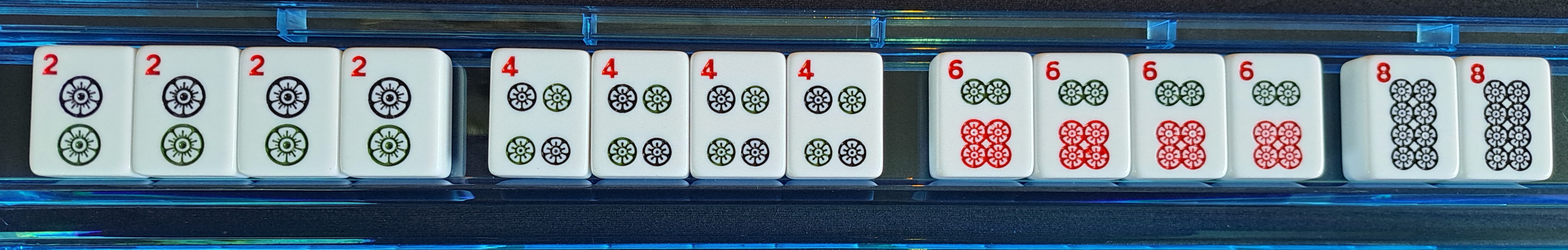 Single suit of dots with kong of 2s, kong of 4s, kons of 6s, and pair of 8s.