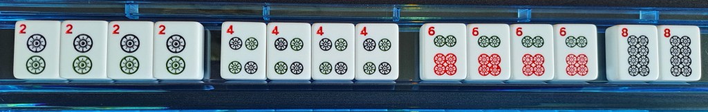 One suit of dots, Kong of 2s, Kong of 4s, Kong of 6s, and Pair of 8s