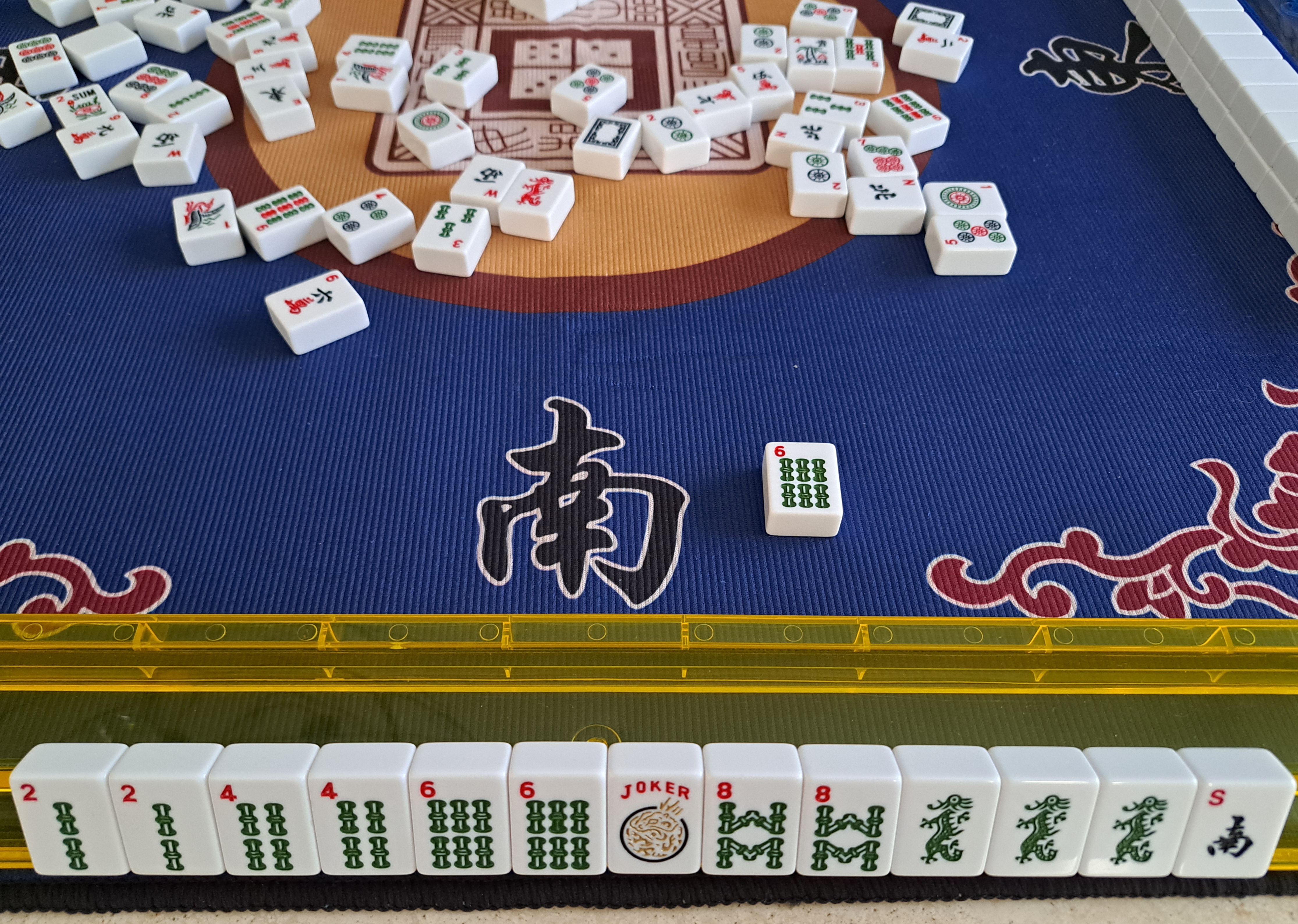 mahjong tiles 2468 hand with bams and green dragons claiming the 6 bam discard