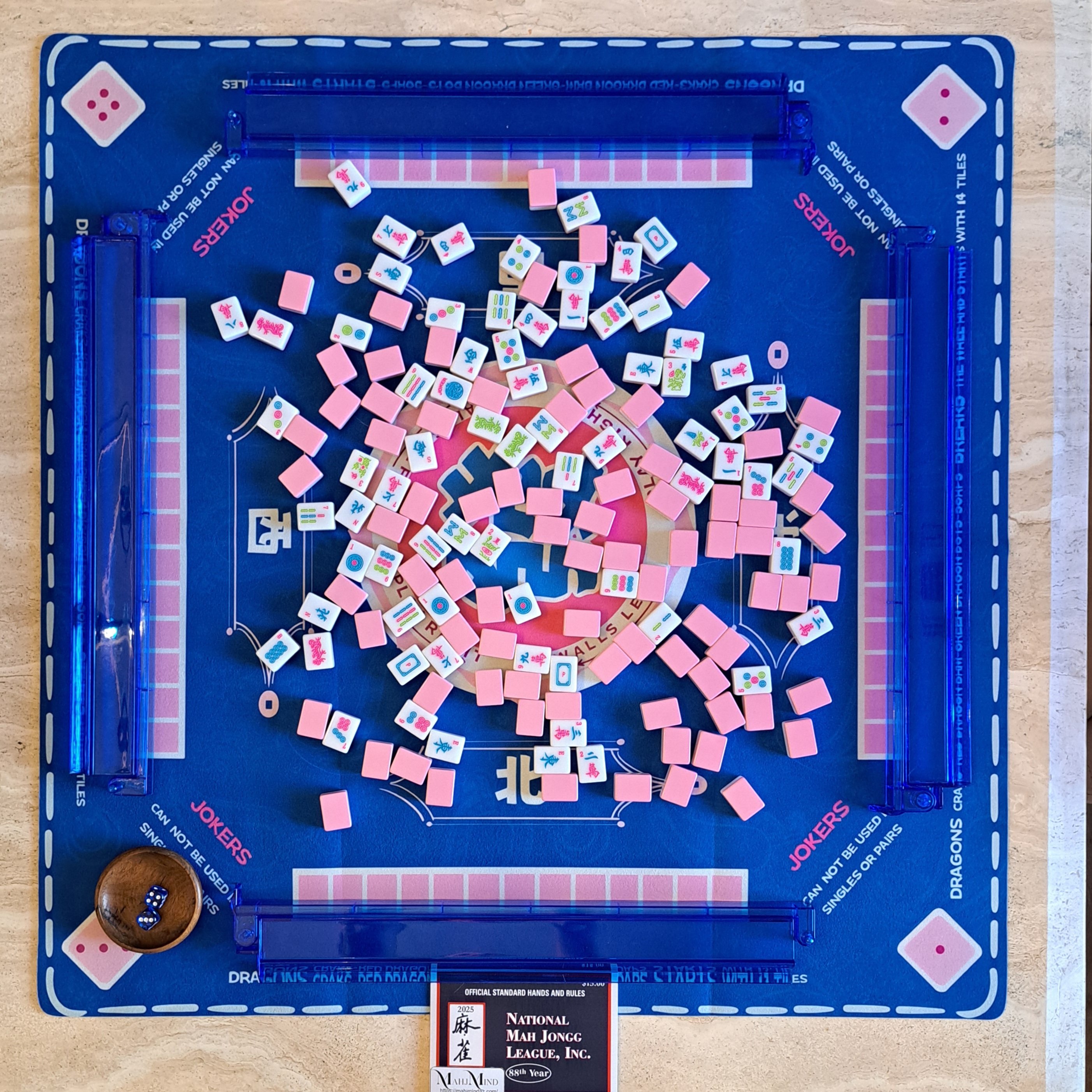 Shuffle Mahjong tiles during an NMJL American Mahjong game.